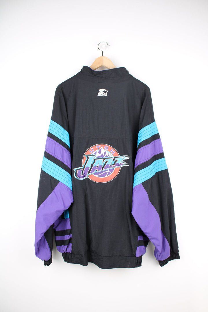 Vintage 1996 Utah Jazz NBA zip through track jacket in black and purple by Starter, features embroidered logos and badges