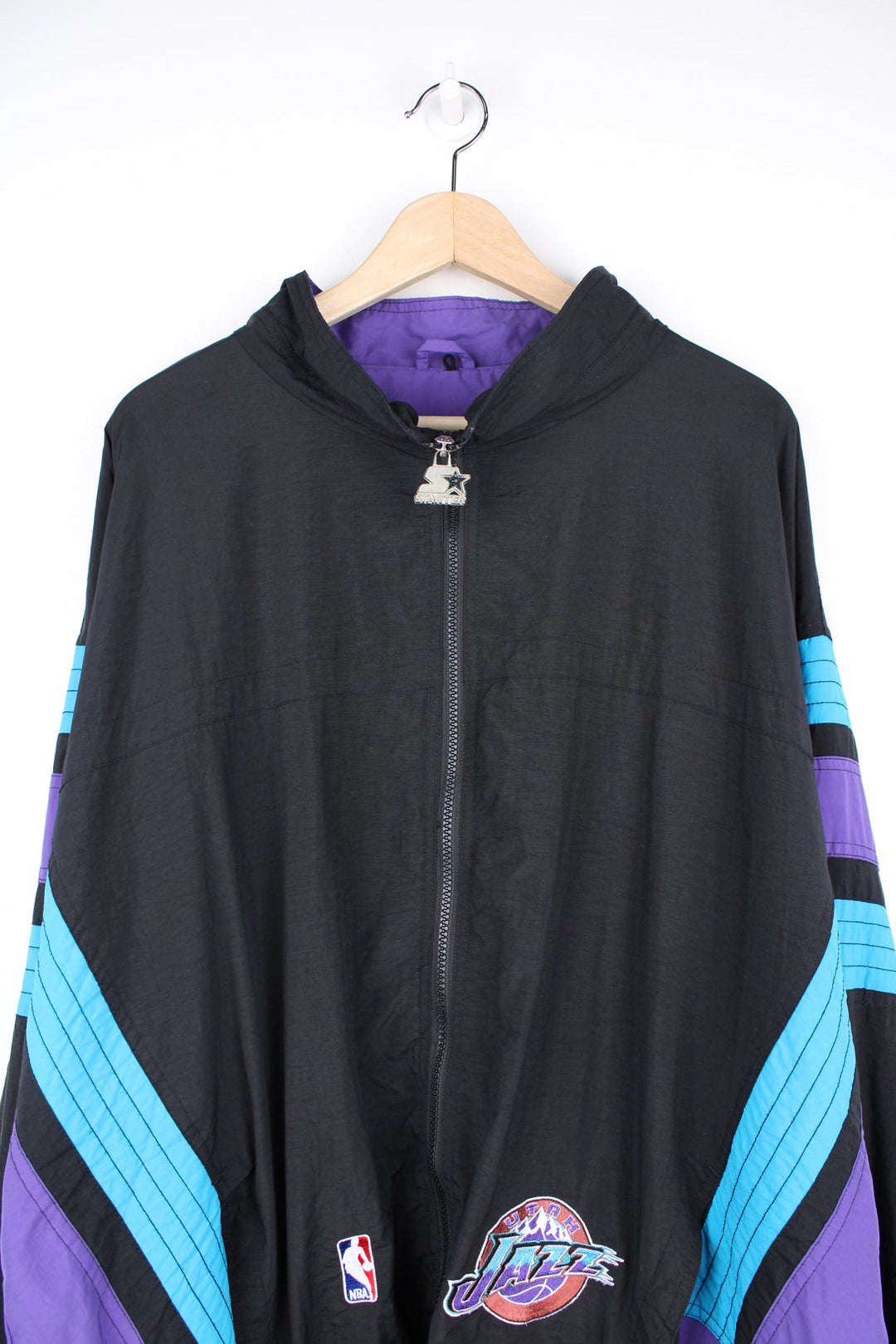 Vintage 1996 Utah Jazz NBA zip through track jacket in black and purple by Starter, features embroidered logos and badges