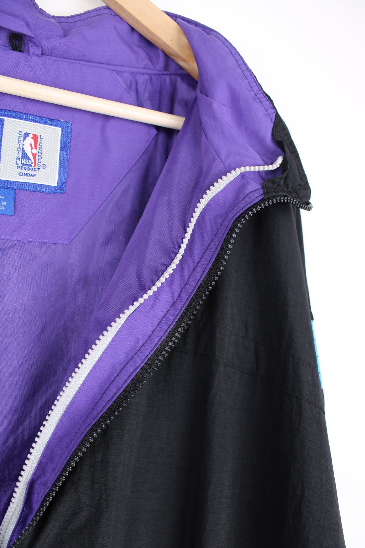 Vintage 1996 Utah Jazz NBA zip through track jacket in black and purple by Starter, features embroidered logos and badges