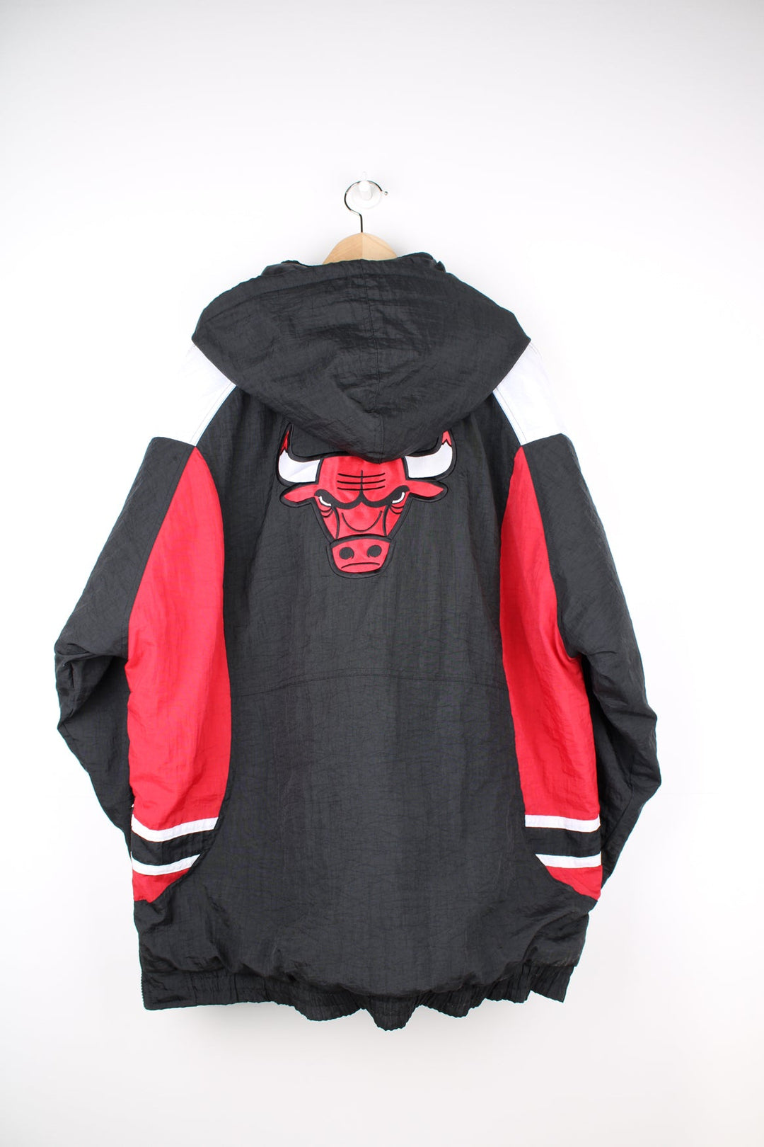 Chicago Bulls red and black insulated 1/4 zip pro sports jacket by Reebok features embroidered logos on the chest and back