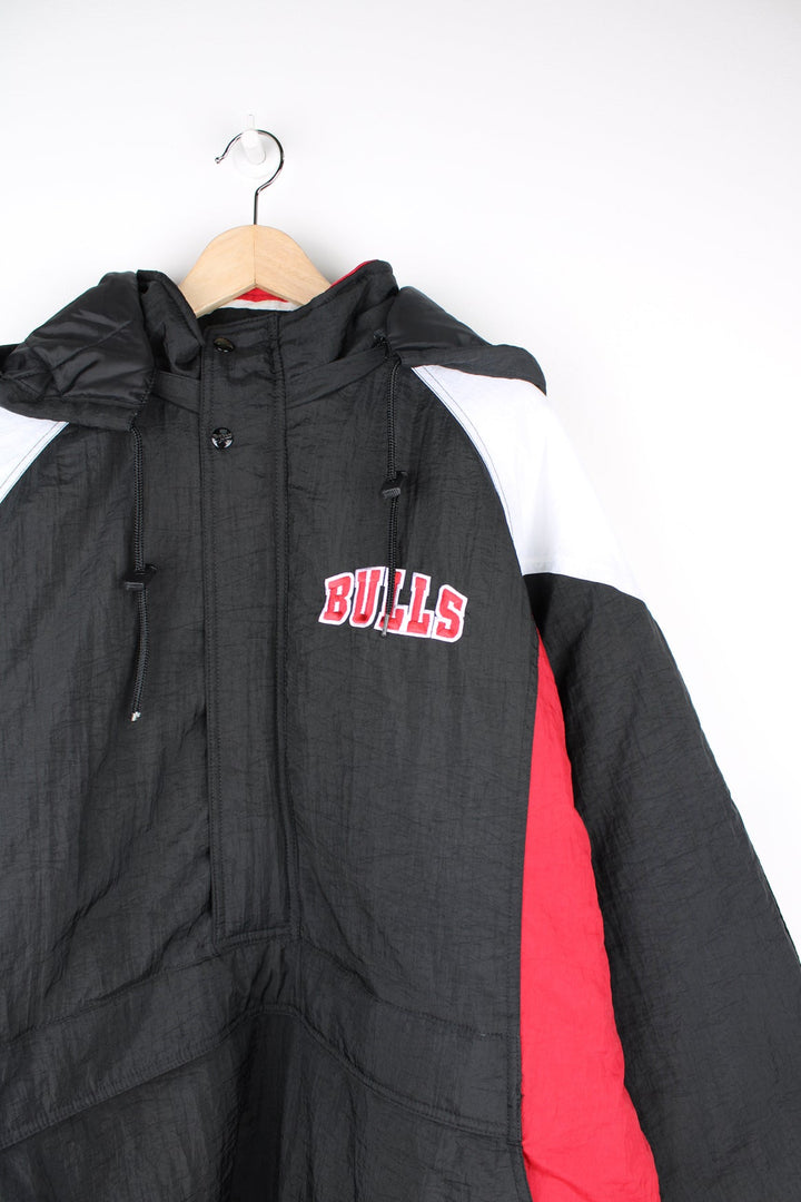 Chicago Bulls red and black insulated 1/4 zip pro sports jacket by Reebok features embroidered logos on the chest and back