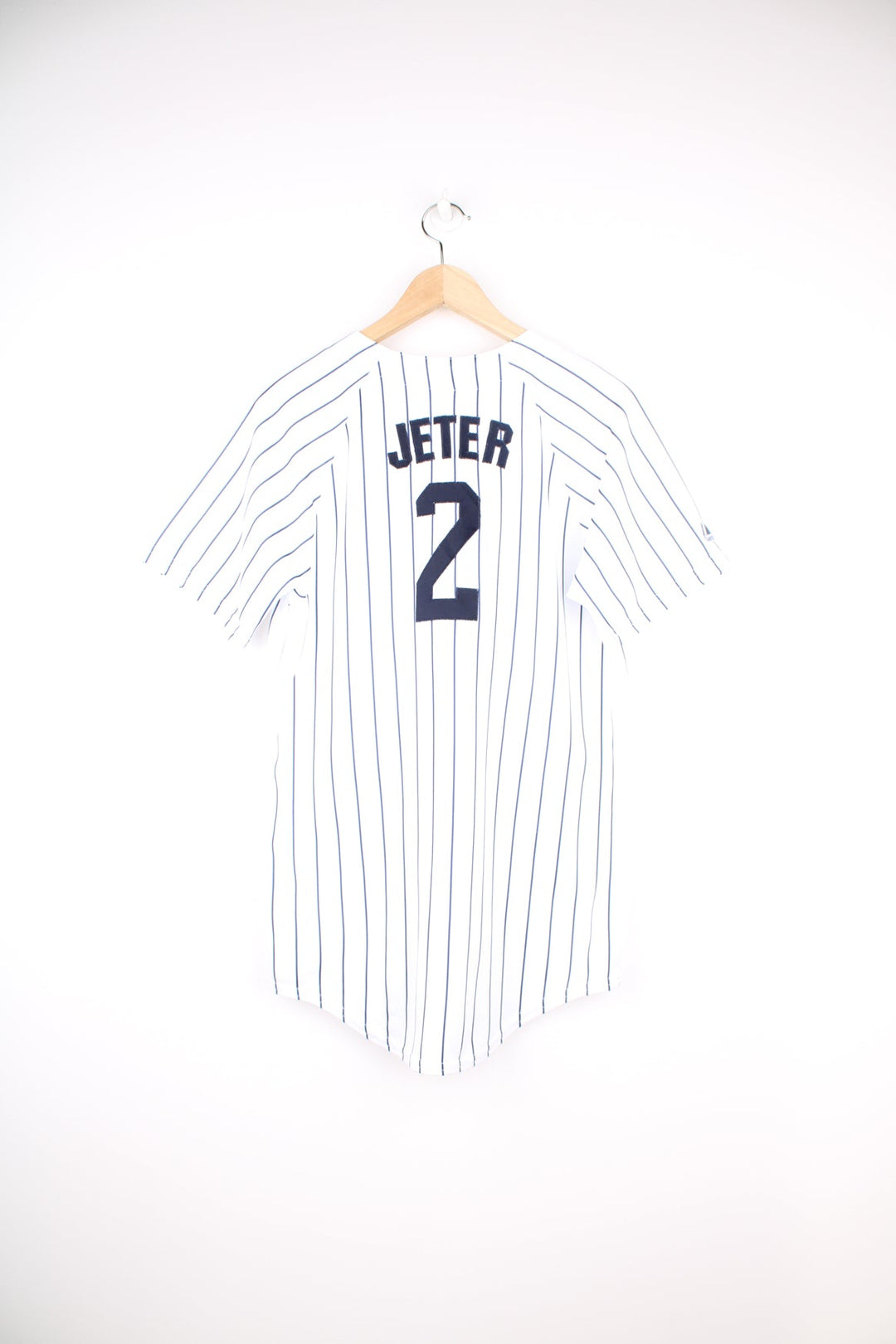 Vintage New York Yankees #2 Derek Jeter MLB jersey by Majestic. Features embroidered lettering and pinstripe print