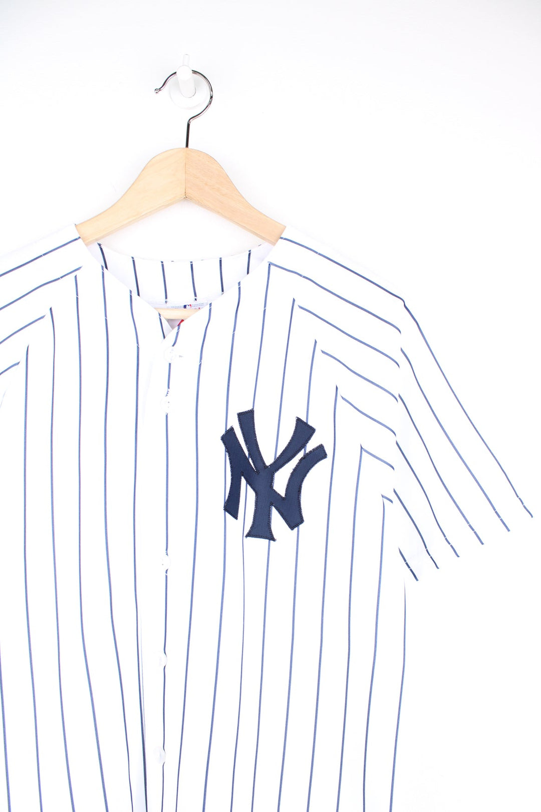 Vintage New York Yankees #2 Derek Jeter MLB jersey by Majestic. Features embroidered lettering and pinstripe print