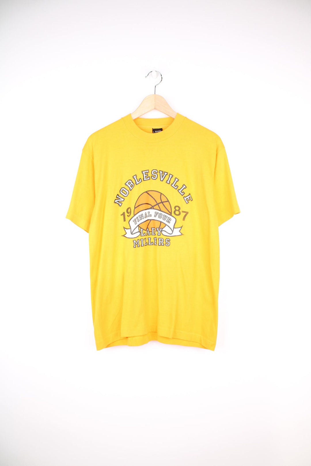 Vintage 1987 yellow single stitch graphic tee with Noblesville , Lady Millers  spell-out on the front