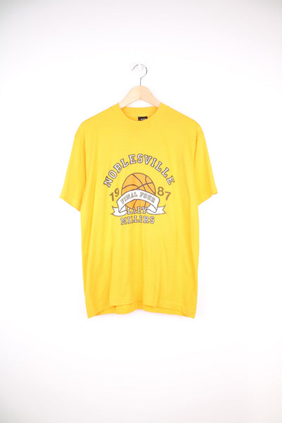 Vintage 1987 yellow single stitch graphic tee with Noblesville , Lady Millers  spell-out on the front