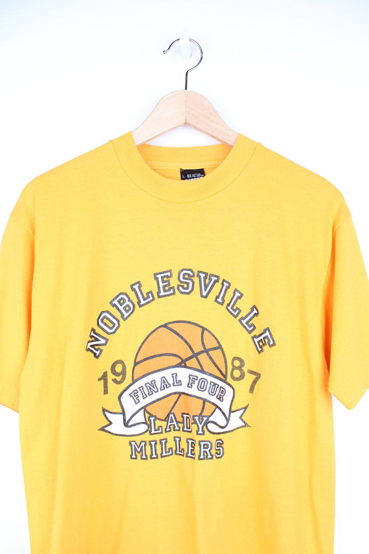 Vintage 1987 yellow single stitch graphic tee with Noblesville , Lady Millers  spell-out on the front