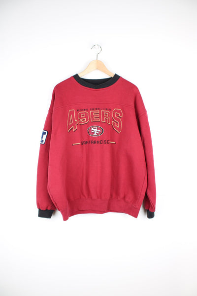 Vintage San Francisco 49ers sweatshirt with embroidered logo across the chest and badge on the sleeve, by Lee Sport.