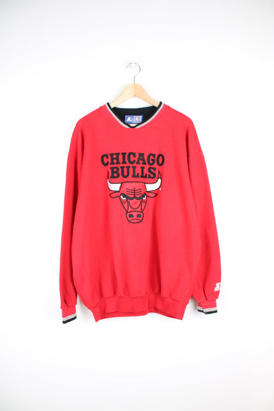 Vintage 90s Chicago Bulls v-neck sweatshirt with large embroidered logo across the chest.