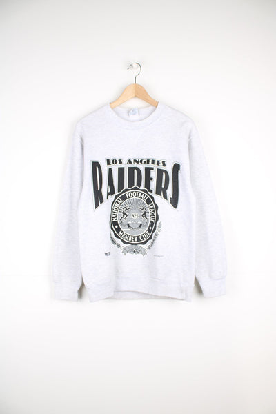 Vintage Raiders sweatshirt with large print on the front.