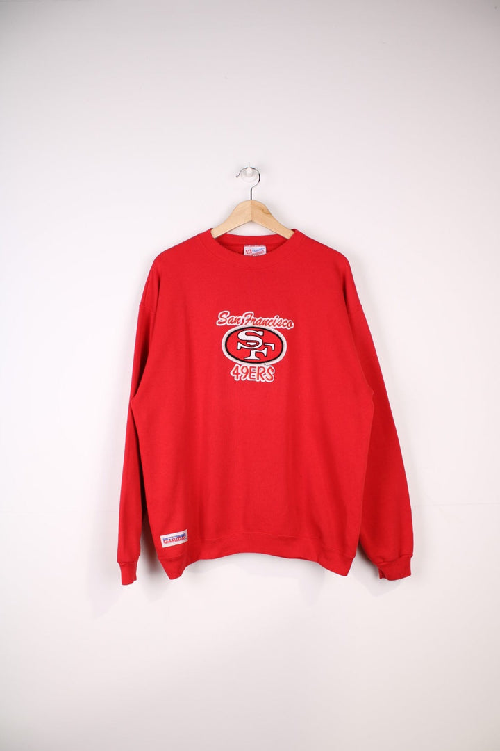 Vintage San Francisco 49ers NFL Sweatshirt in a red colourway with the team spell out logo embroidered on front.