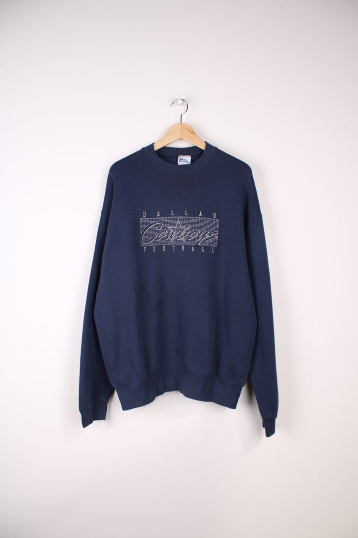 Dallas Cowboys NFL Sweatshirt in a navy blue colourway with the team spell out logo embroidered across the front.