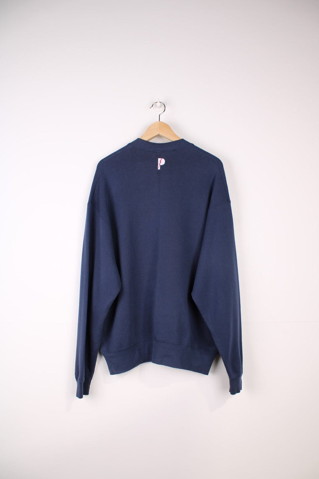 Dallas Cowboys  Sweatshirt in a navy  colourway with the team spell out logo embroidered across the front.