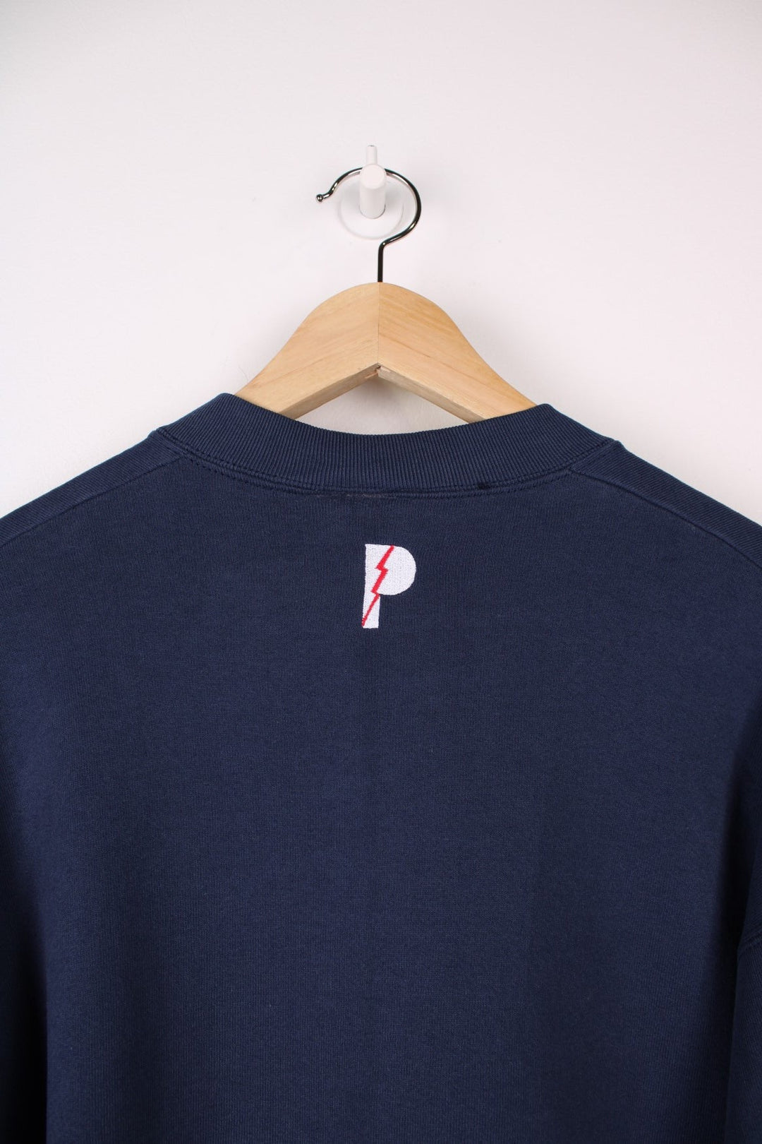 Dallas Cowboys  Sweatshirt in a navy  colourway with the team spell out logo embroidered across the front.