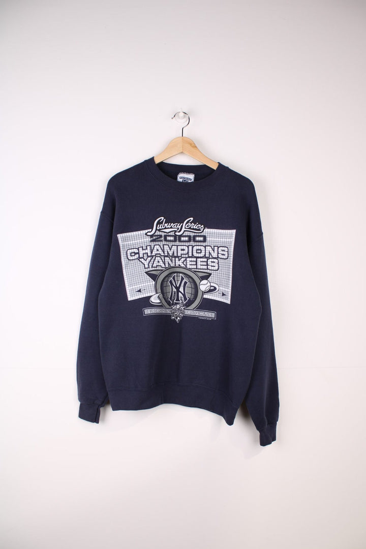 2000 New York Yankes MLB Subway Series Champions Sweatshirt in a blue colourway with the team logo and spell out printed on front.