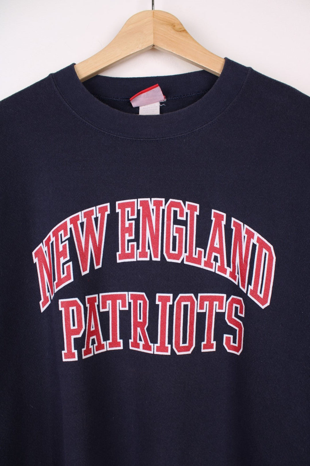 Vintage New England Patriots  Sweatshirt in a  colourway with the team spell out printed across the front.