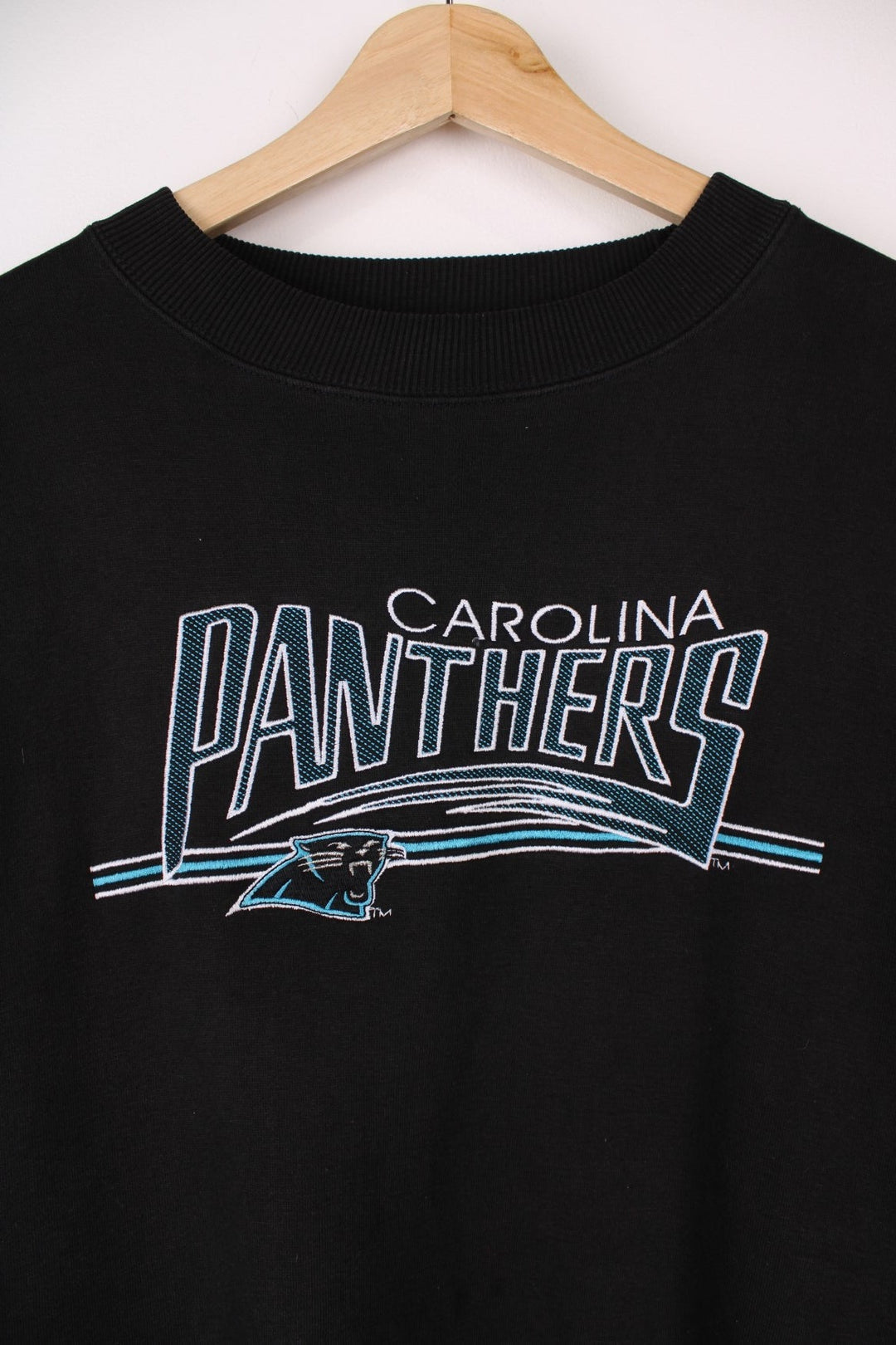 Carolina Panthers  Sweatshirt in a  colourway with the team logo and spell out embroidered across the front.