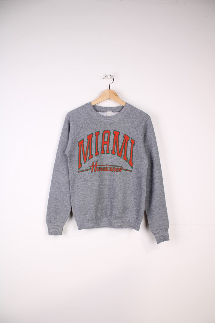 Vintage University of Miami Hurricane Sweatshirt in a grey colourway with the team spell out printed across the front.