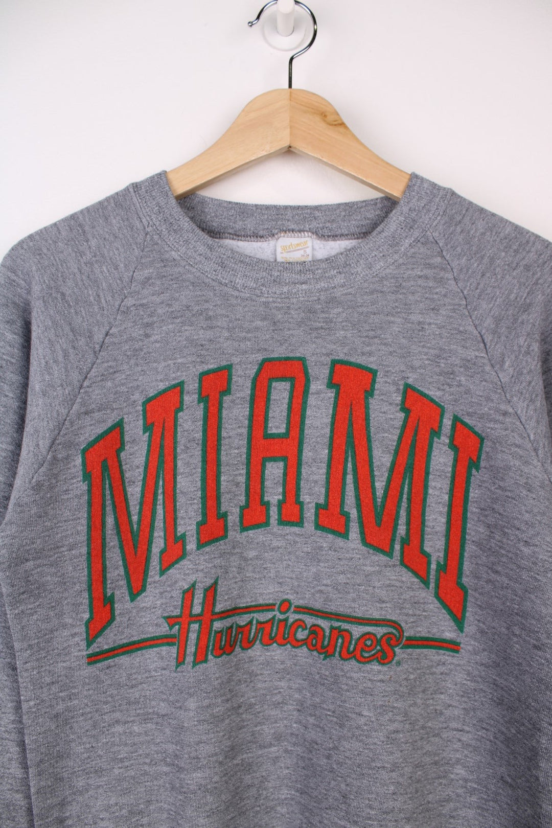  University of Miami Hurricane Sweatshirt in a  colourway with the team spell out printed across the front.