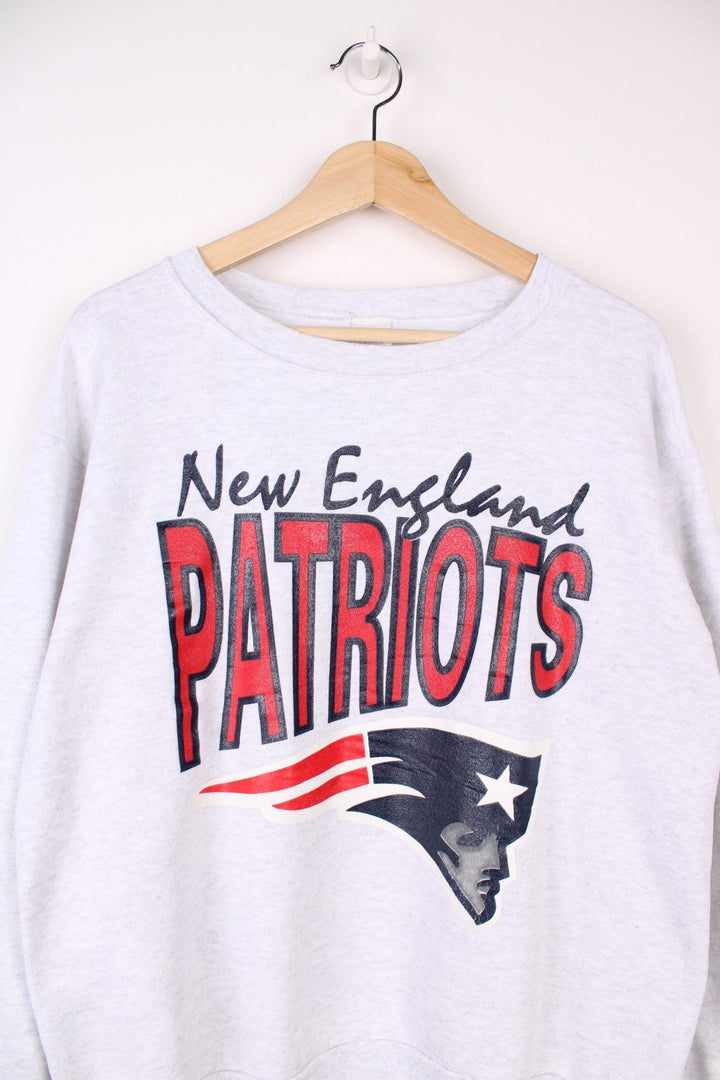 Vintage New England Patriots  Sweatshirt in a  colourway with the team logo and spell out printed across the front.