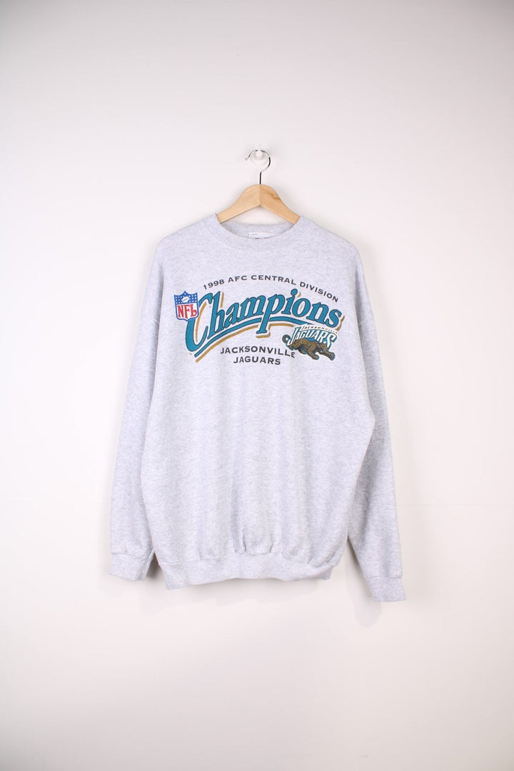 1998 Jacksonville Jaguars NFL Central Division Champions Sweatshirt in a grey colourway with the team logo and spell out printed on the front.