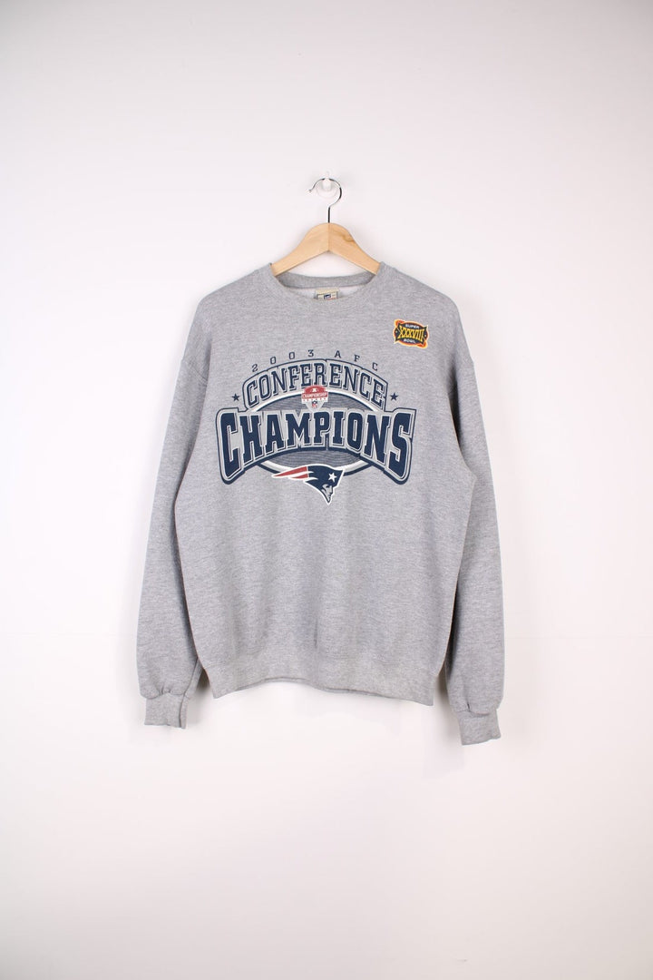 New England Patriots NFL 2003 Conference Champions Sweatshirt in a grey colourway with the team logo and spell out printed across the front.