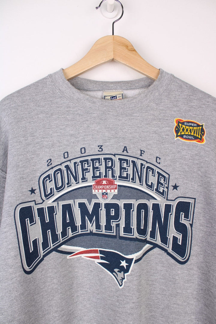 New England Patriots  2003 Conference Champions Sweatshirt in a  colourway with the team logo and spell out printed across the front.