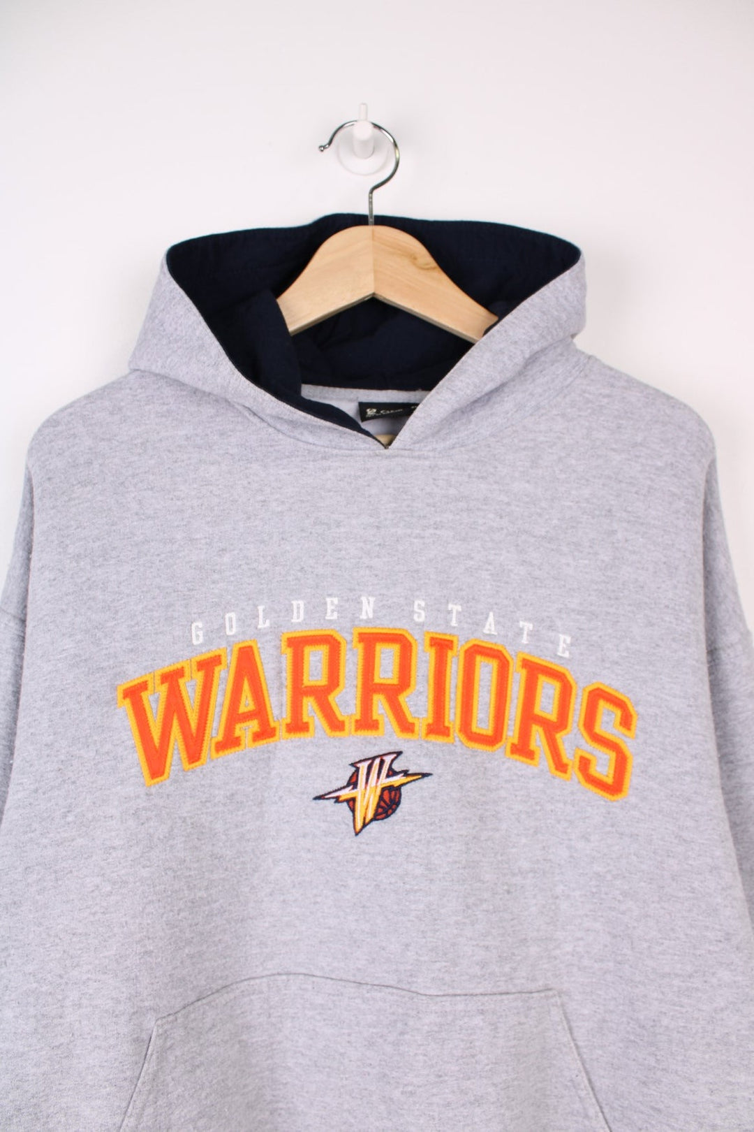 Golden State Warriors  Hoodie in a  colourway with the team logo and spell out embroidered across the front.