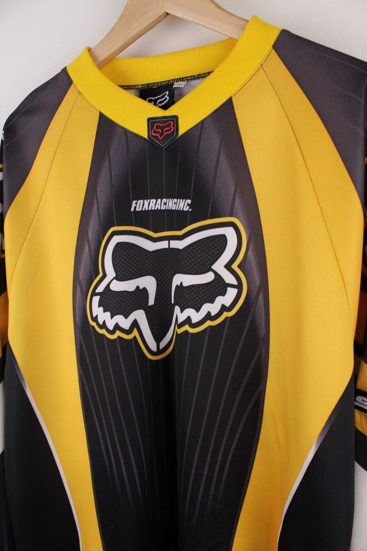  90's Fox Racing Motorcross Jersey in a  and yellow colourway, has the spell out and logo printed on the front and going down the sleeves.