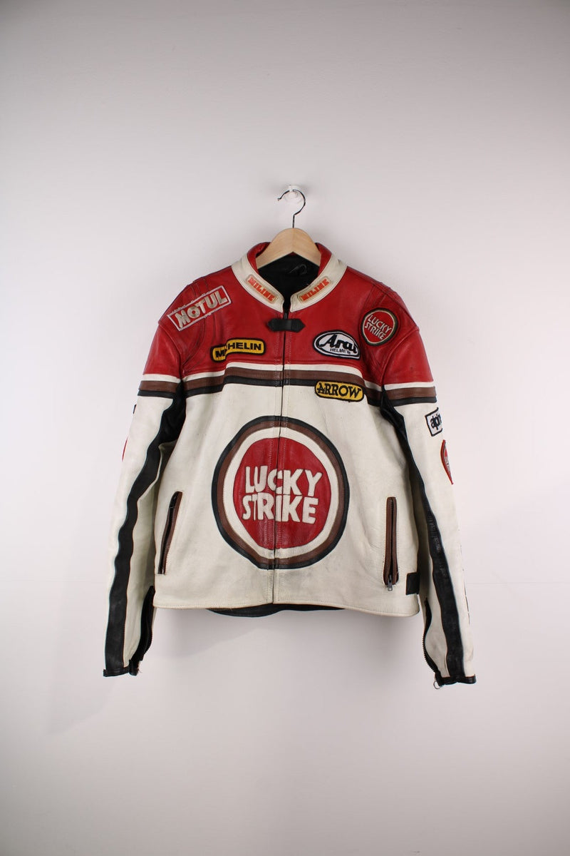 Vintage Lucky Strike Nascar Racing Jacket in a white and red colourway, zips up with side pockets, and has the logos embroidered all over the jacket and the back is signed.