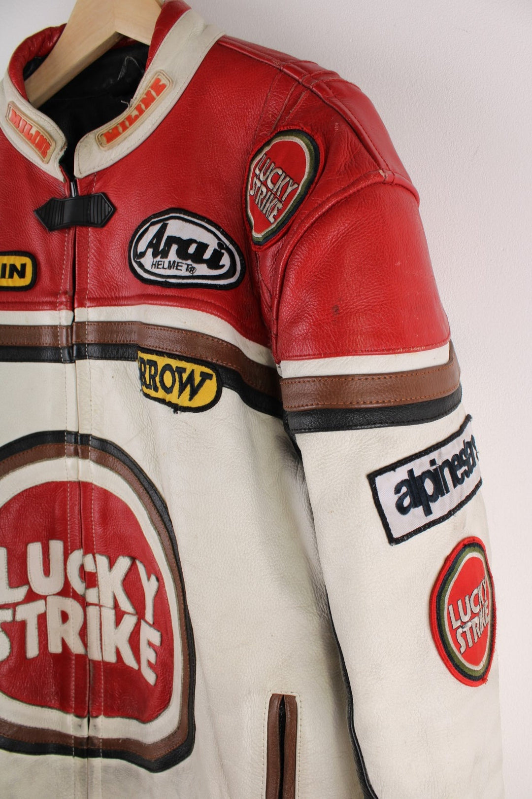 Vintage Lucky Strike  Racing Jacket in a  and red colourway, zips up with side pockets, and has logo embroidered all over the jacket and the back is signed.