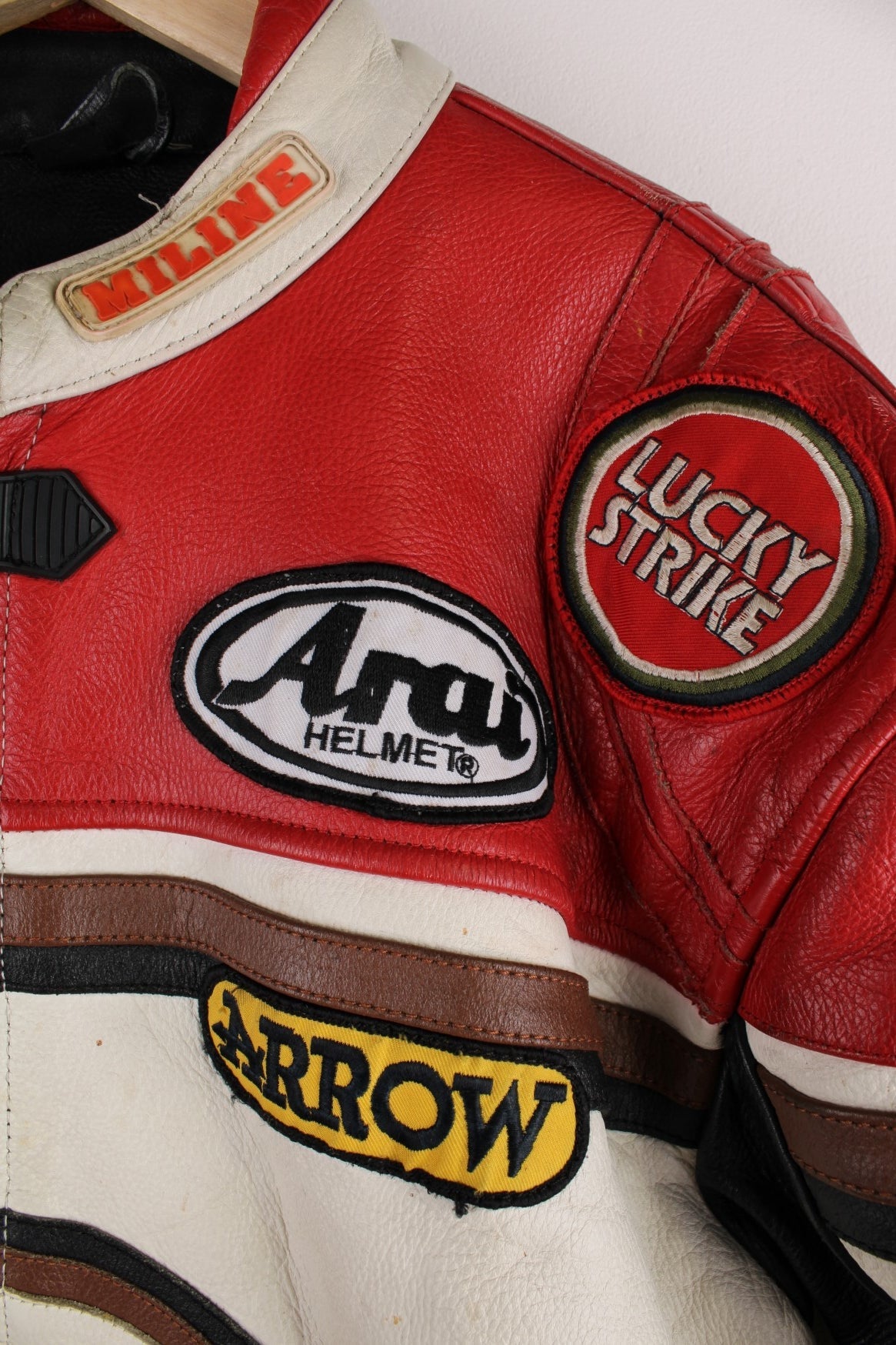 Vintage Lucky Strike  Racing Jacket in a  and red colourway, zips up with side pockets, and has logo embroidered all over the jacket and the back is signed.