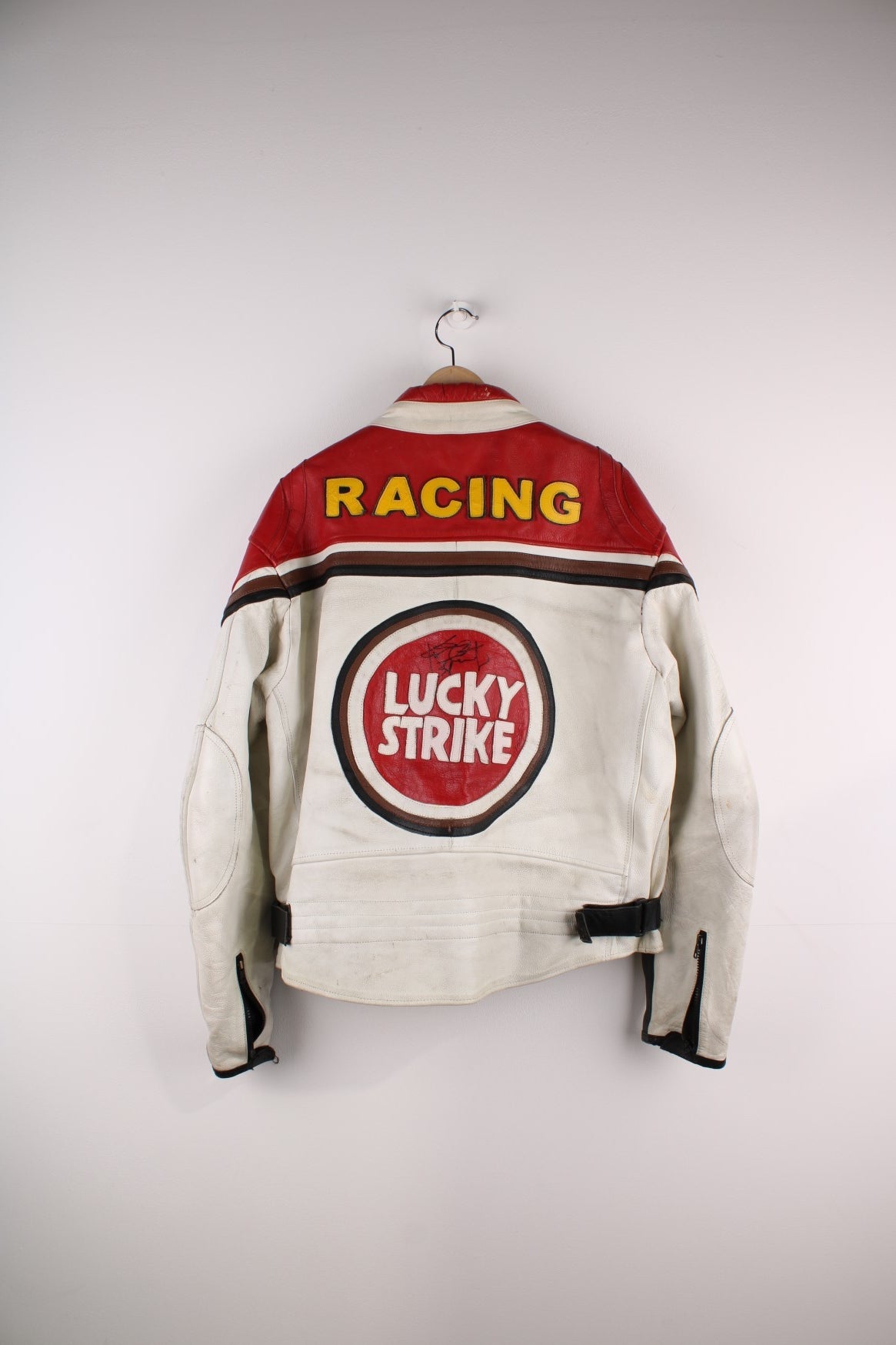 Vintage Lucky Strike  Racing Jacket in a  and red colourway, zips up with side pockets, and has logo embroidered all over the jacket and the back is signed.