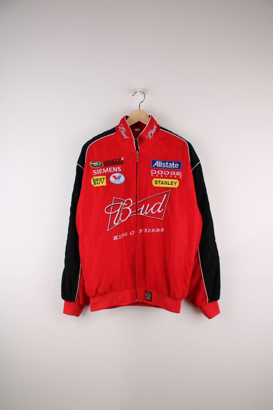 Vintage Budweiser Nascar Racing Jacket in a red and black colourway, zip up closure, has side pockets, and the spell out logos embroidered on all over the jacket. 