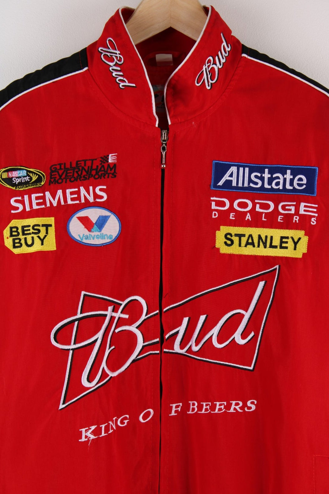 Vintage Budweiser  Racing Jacket in a  and black colourway, zip up closure, has side pockets, and the spell out logos embroidered on all over the jacket. 