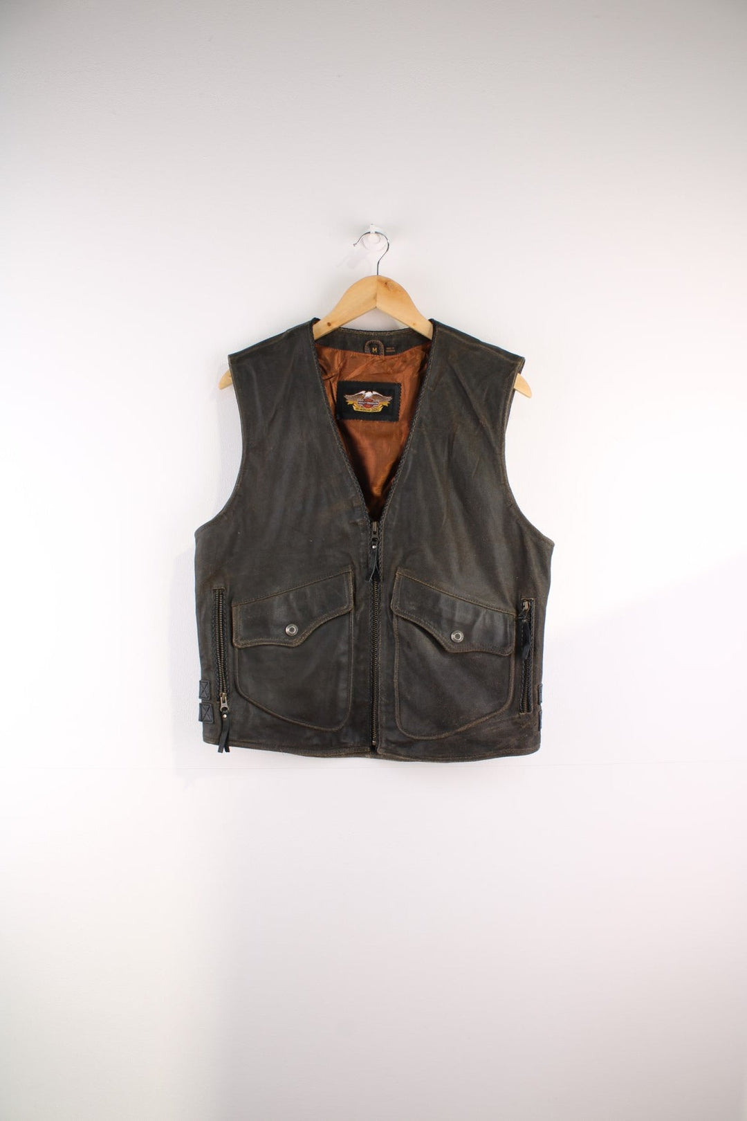 Vintage Harley-Davidson Leather Biker Vest in a brown colourway, zips up and has a v neck collar, side pockets, and the logo embroidered on the back.