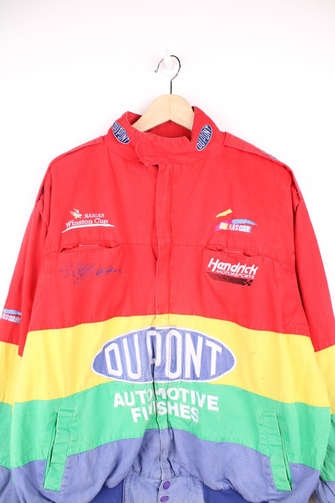 Vintage Jeff Gordon Du Pont, NASCAR bomber jacket in red, yellow, green and blue. Features embroidered logo and badge.