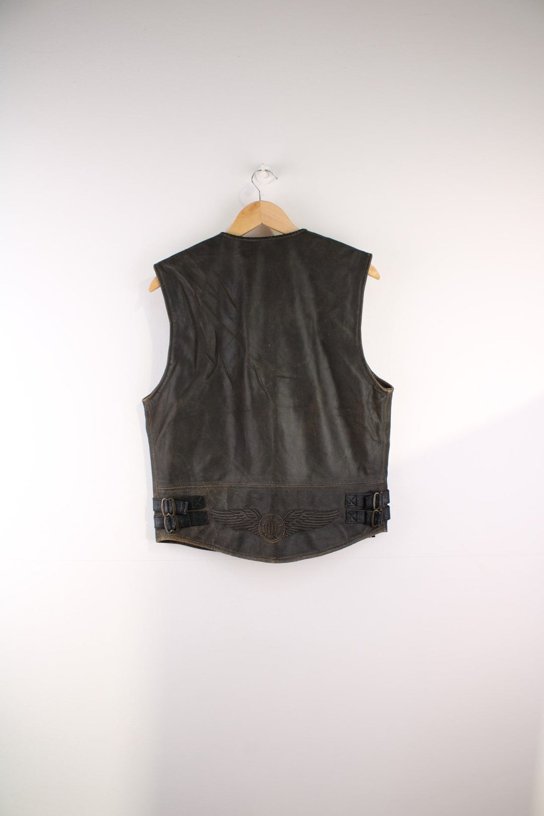 Vintage  Leather Biker Vest in a  colourway, zips up and has a v neck collar, side pockets, and the logo embroidered on the back.