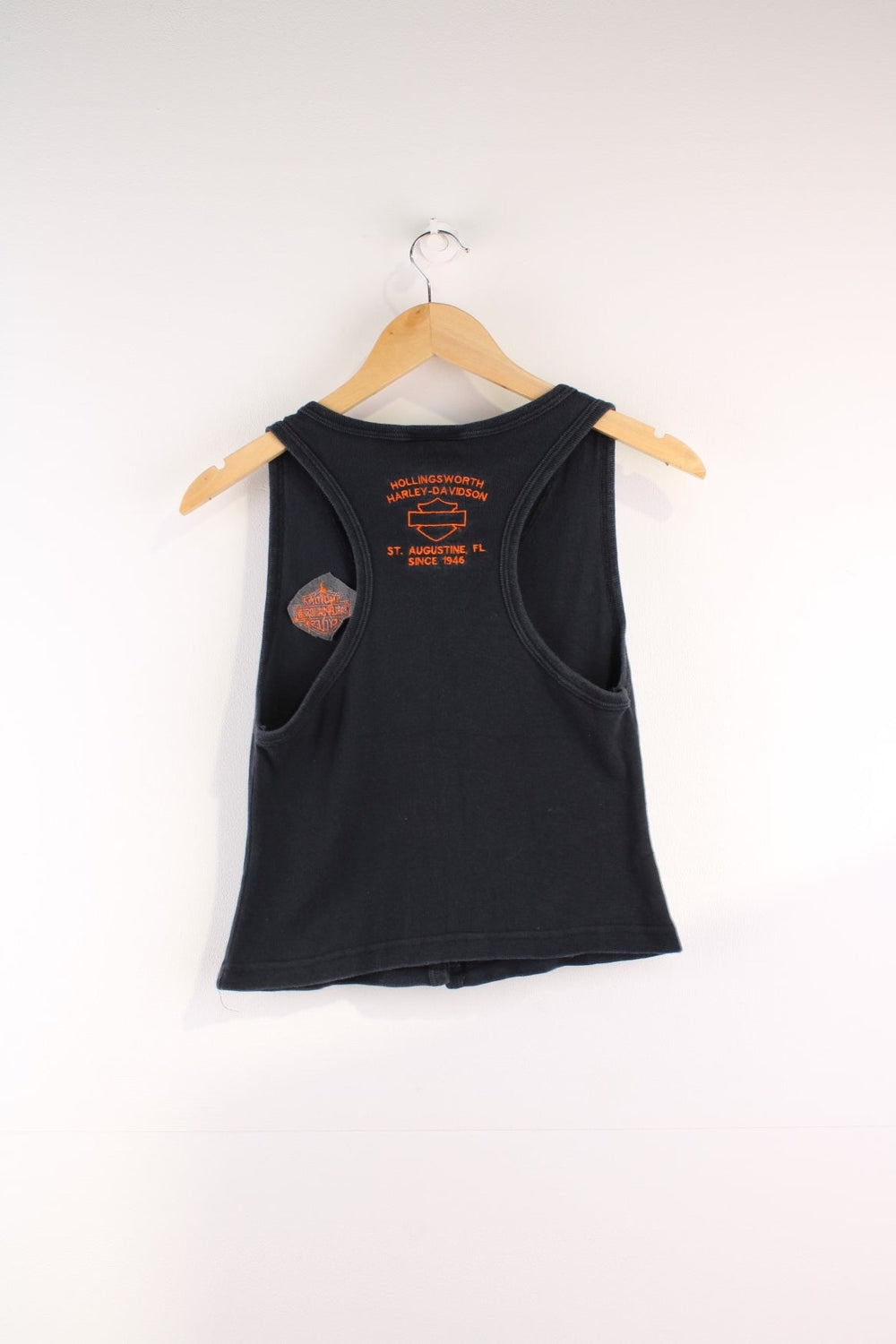  Y2K Vest Top in a  colourway, buttons up and has a v neck collar, and the logo embroidered on the front and back.