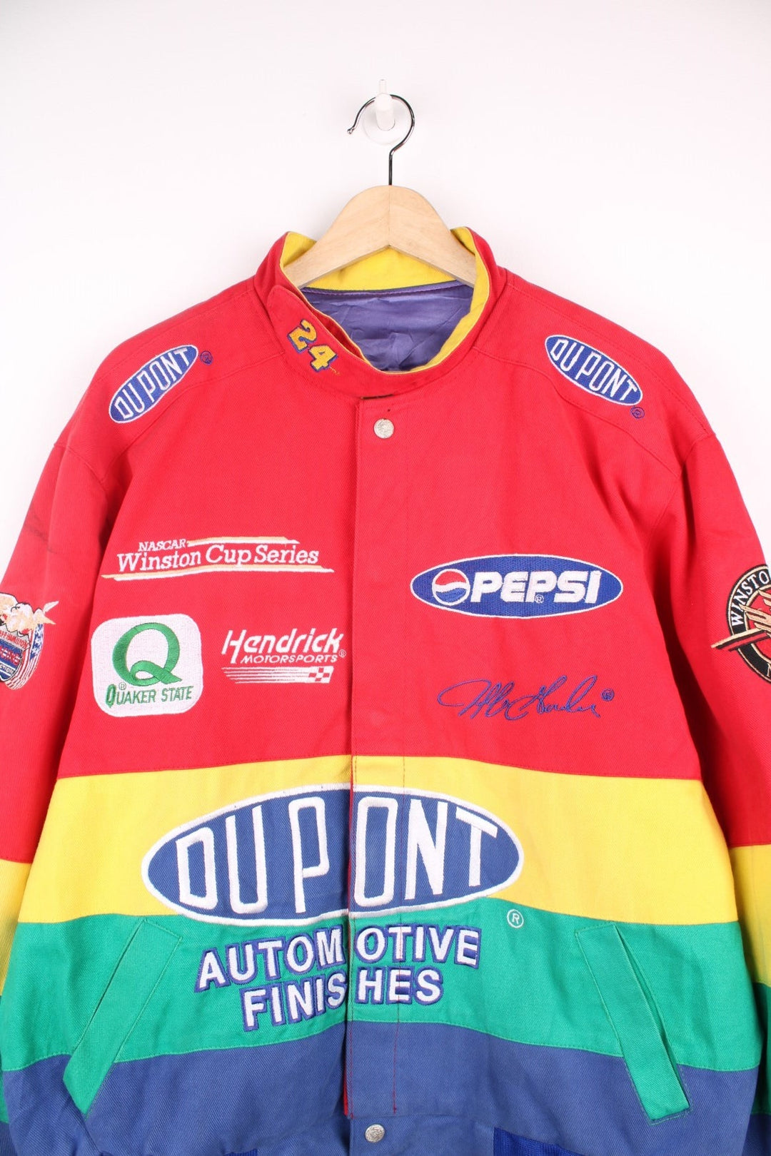 Vintage Jeff Gordon Du Pont, NASCAR bomber jacket in red, yellow, green and blue. Features embroidered badges.