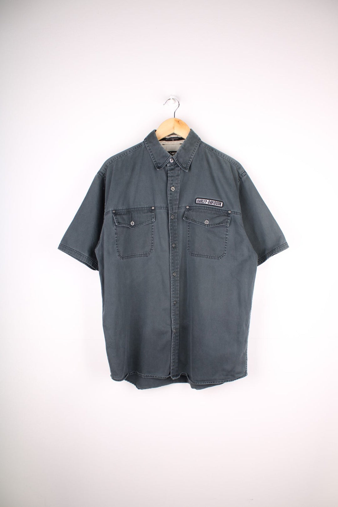 Harley-Davidson Short Sleeve Shirt in a grey colourway, buttons up, has double chest pockets, and the spell out logo embroidered on the front.