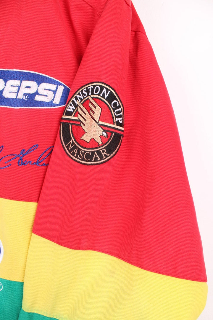 Vintage Jeff Gordon Du Pont, NASCAR bomber jacket in red, yellow, green and blue. Features embroidered badges.