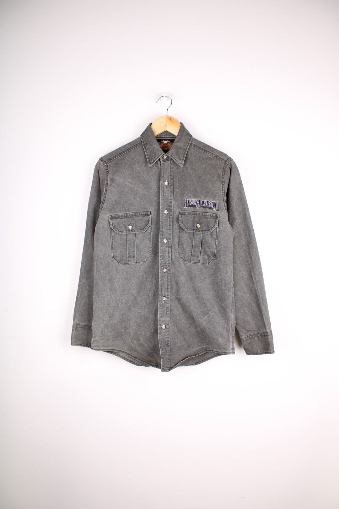 Harley-Davidson Shirt in a denim grey colourway, buttons up, has double chest pockets, and the spell out logo embroidered on the front.