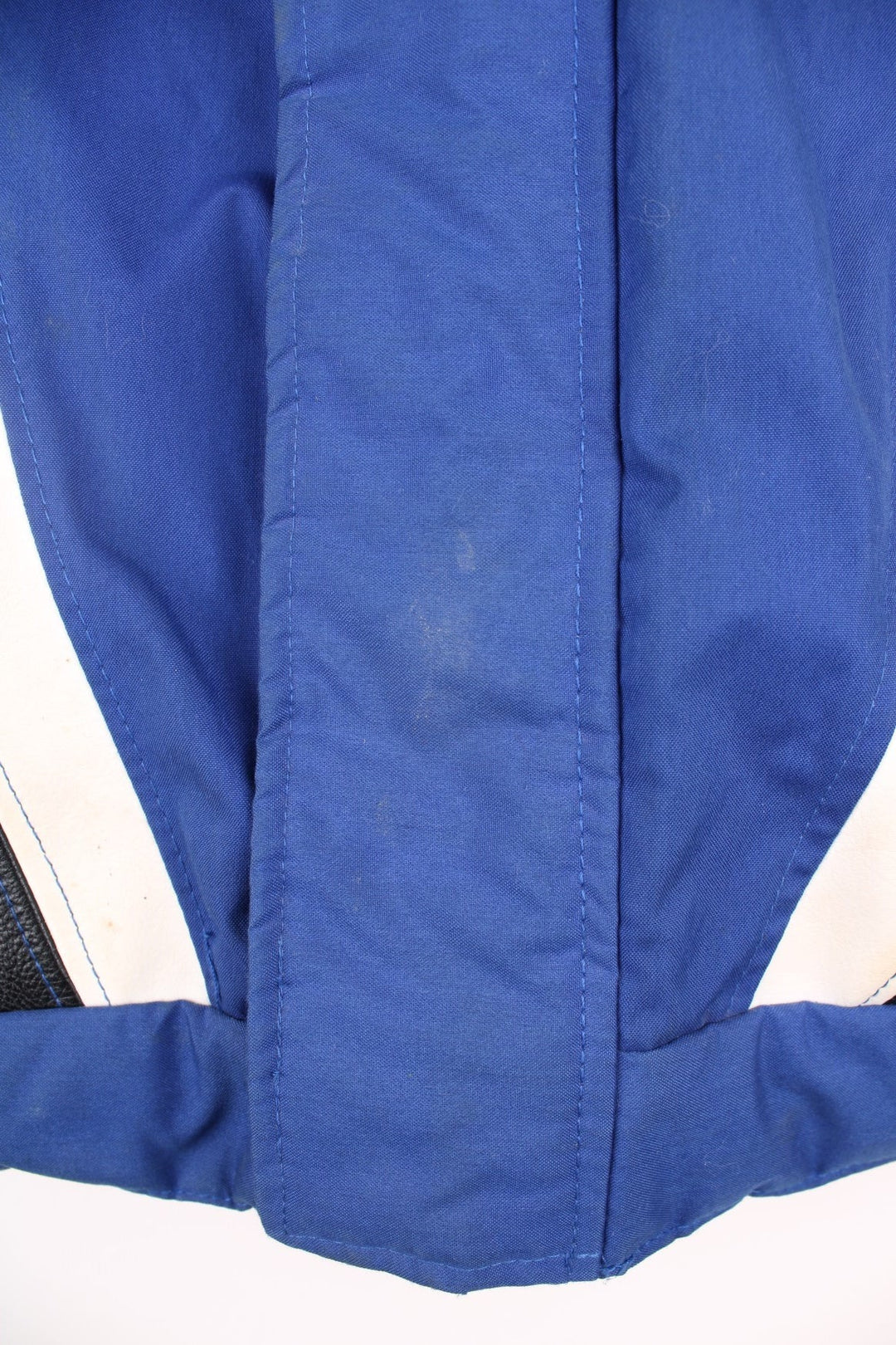 Vintage Suzuki racing jacket in blue, black and white. Features embroidered logo. 