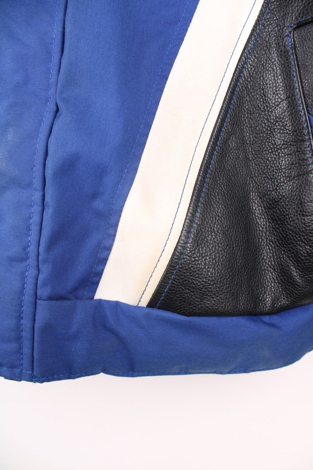 Vintage Suzuki racing jacket in blue, black and white. Features embroidered logo. 