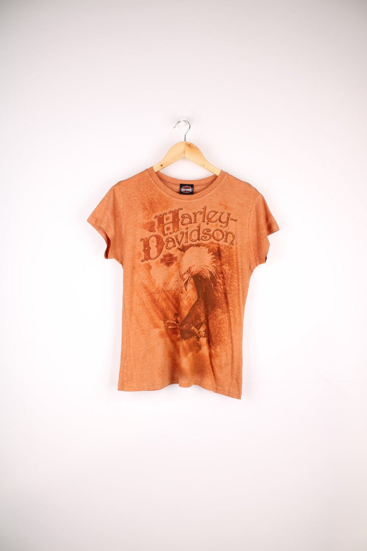 Harley-Davidson Y2K Top in a orange colourway with the spell out logo and eagle graphic printed on the front, and has sequins on the logo.