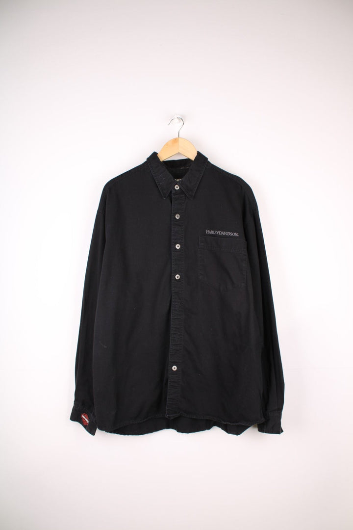 Harley-Davidson Eagle Shirt in a black colourway, buttons up, has a chest pockets, and the logo embroidered on the front and back as well as screamin eagle graphic.