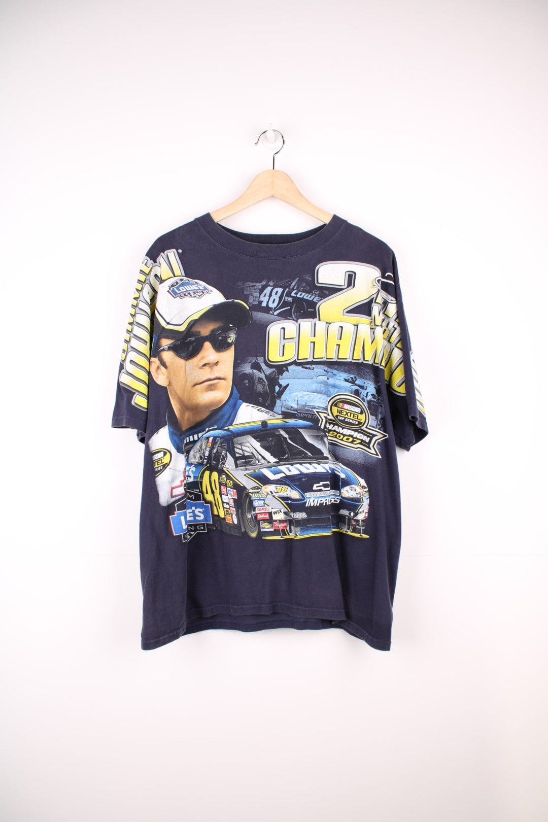 Jimmie Johnson 2007, 2 Time Nextel Cup Champion T-Shirt with all over blue and yellow graphic print. 