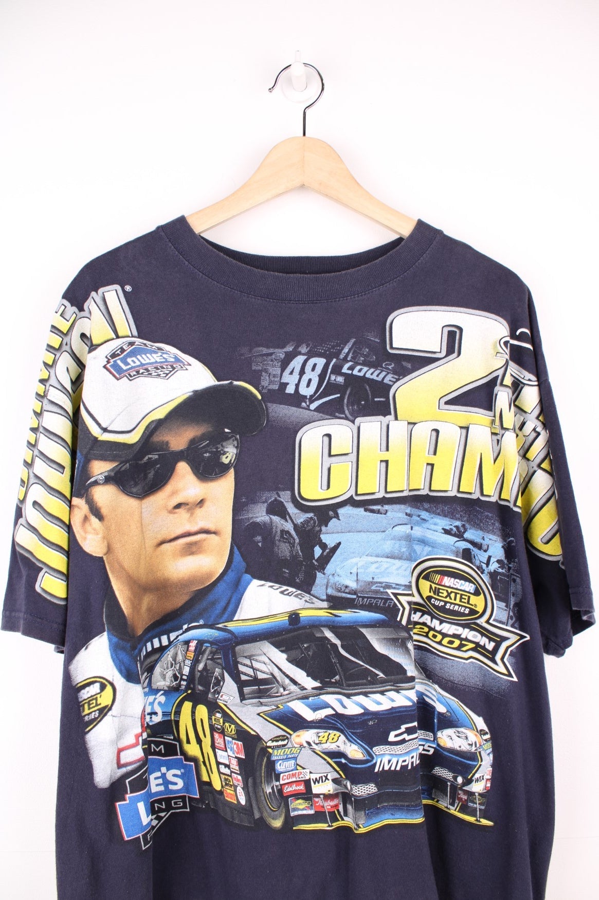 Jimmie Johnson 2007, 2 Time Nextel Cup Champion T-Shirt with all over blue and yellow graphic print. 