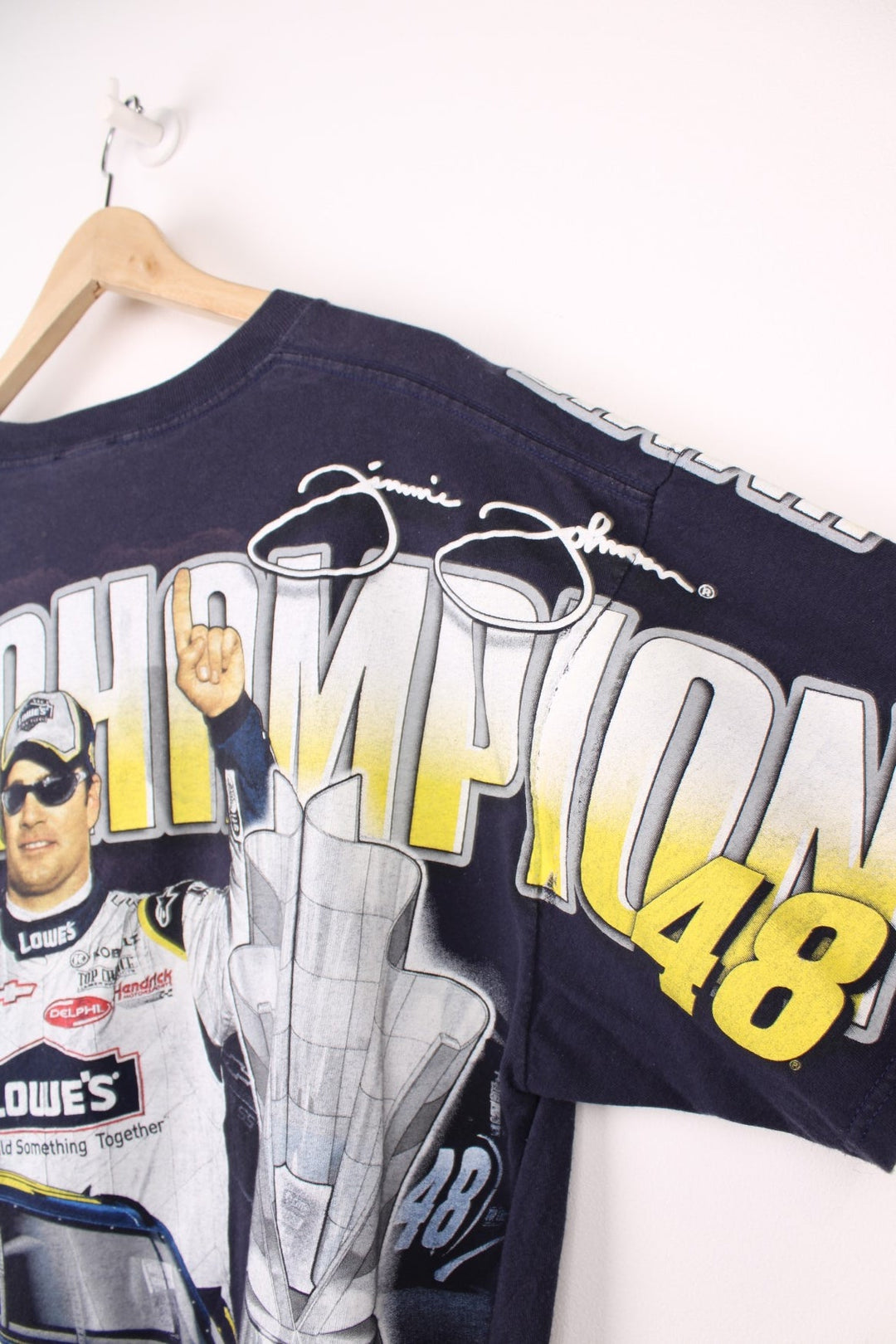 Jimmie Johnson 2007, 2 Time Nextel Cup Champion T-Shirt with all over blue and yellow graphic print. 