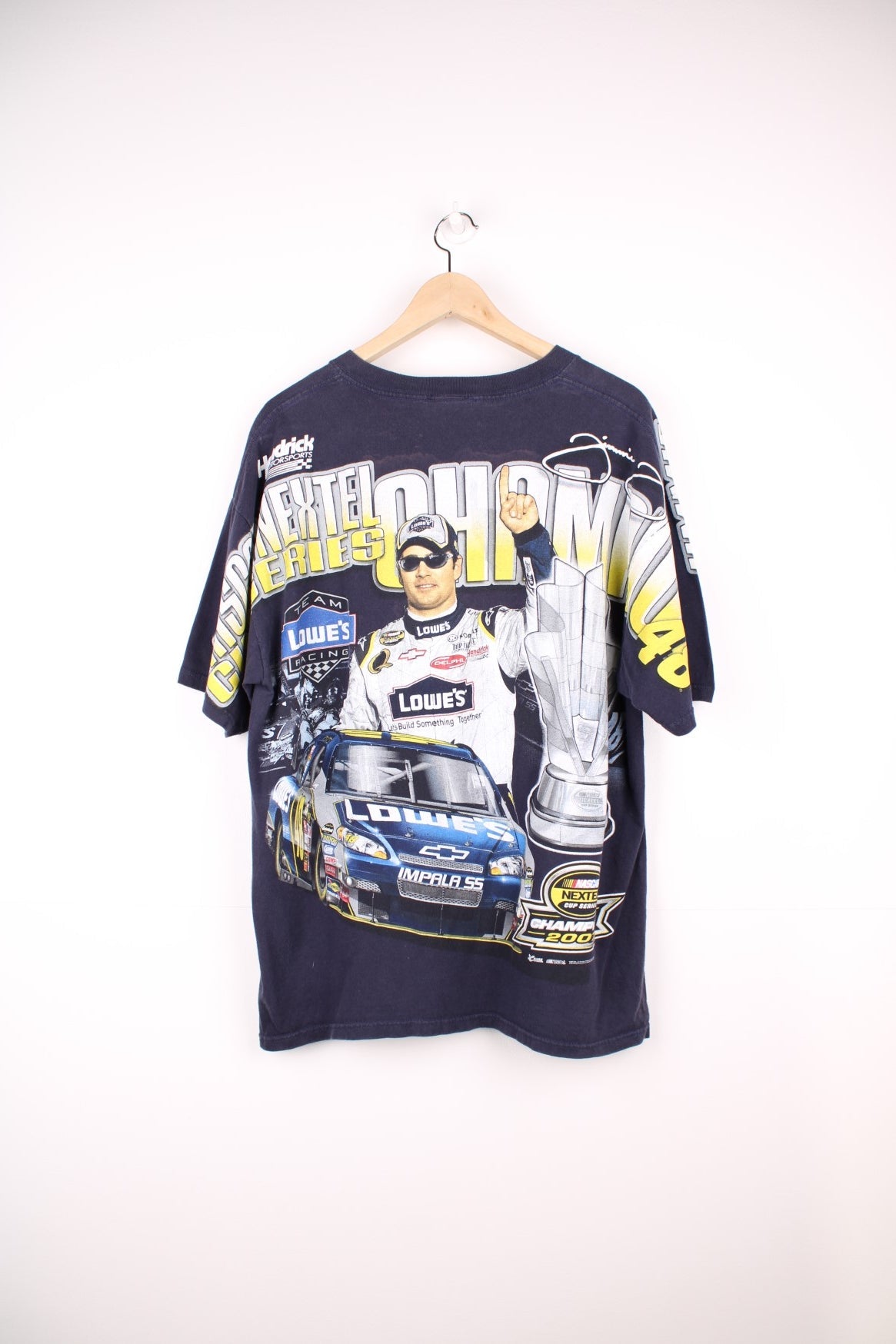 Jimmie Johnson 2007, 2 Time Nextel Cup Champion T-Shirt with all over blue and yellow graphic print. 